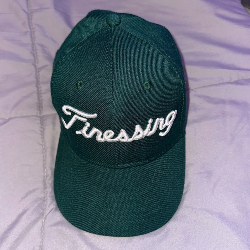 Finessing Miami green hat